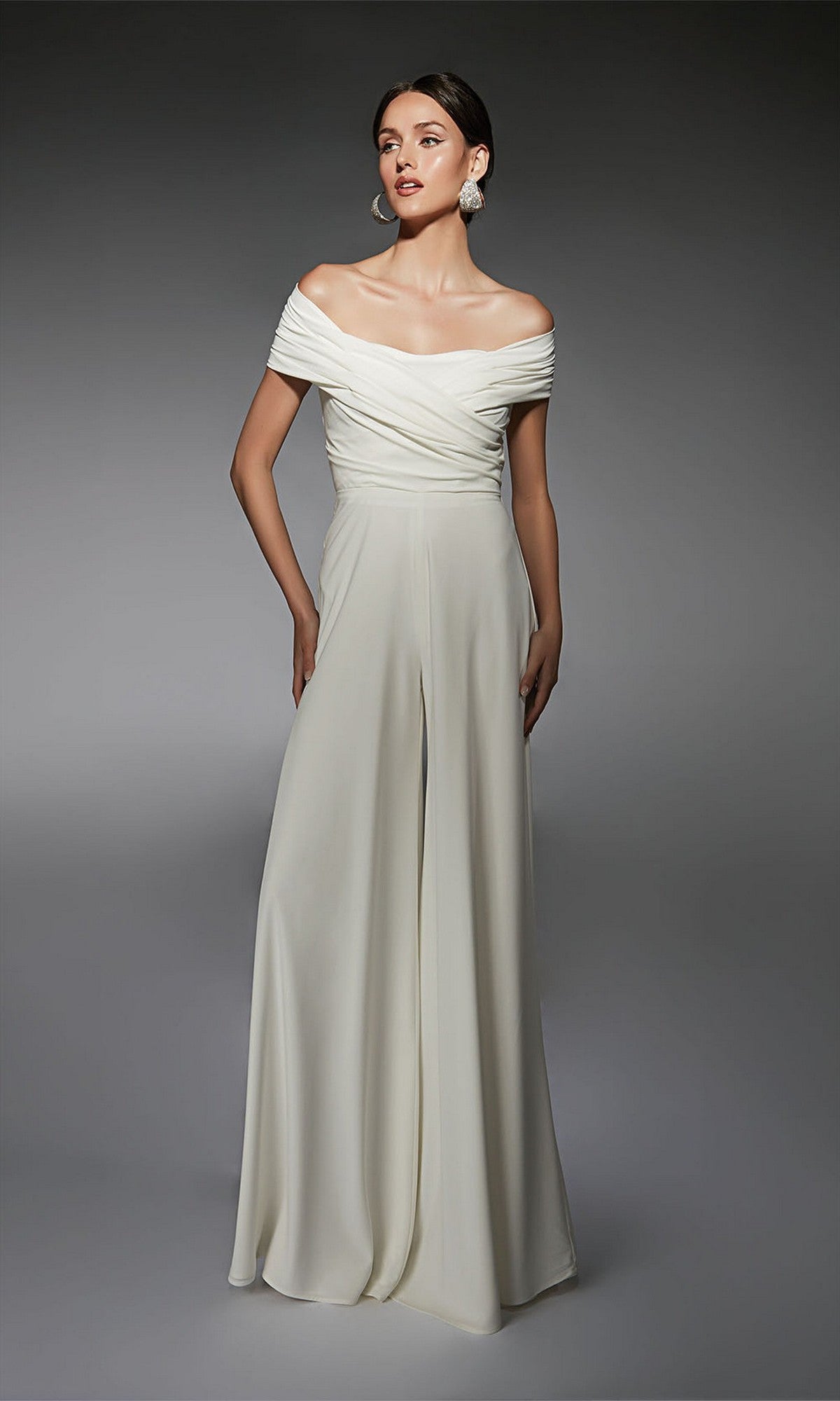 A woman models the Alyce 70067 long formal dress in white, featuring draped detailing and an off-the-shoulder design for an elegant look.